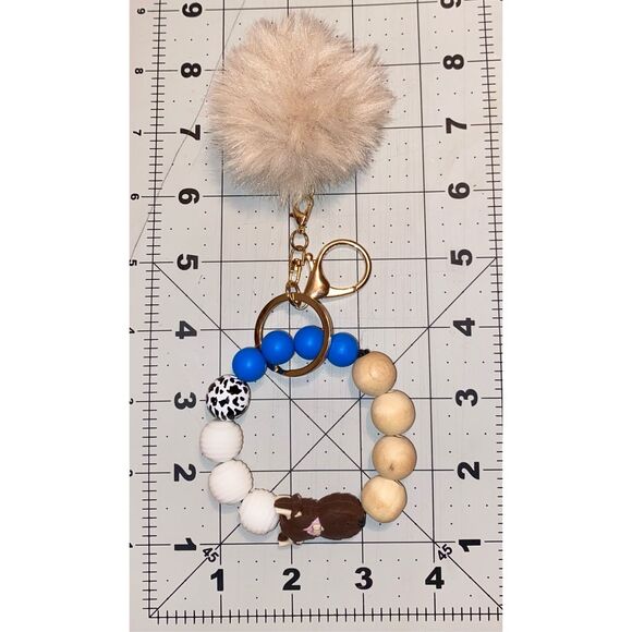 🎀2/$20🎀 Brown and Blue Highland Cow Keychain Wristlet with Pom Pom - Picture 3 of 4
